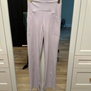 Zella small lavender boot cut, yoga pants with pockets, slits at the bottom.